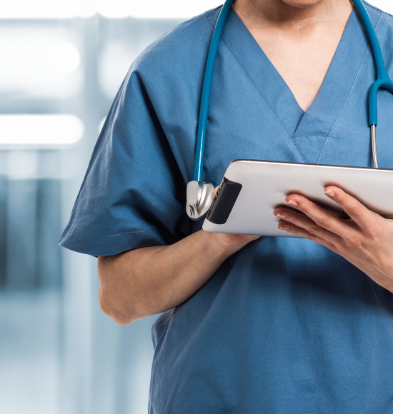 Healthcare professional holding a tablet