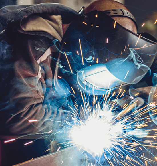 Picture of person welding metal.